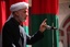 File - President Hamid Karzai addresses Afghan nationals during a conference held outside Provincial Gov. Abdul Karim Barahawi's compound in Zaranj, Nimroz province, Afghanistan, April 13, 2011.