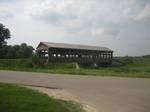 A modern covered bridge in White side County, Illinois Opened on July 4, 1901, the 1,282 foot (390 m) Hart land Bridge, crossing the Saint John River at Hart land, New Brunswick, is the longest covered bridge in the world. It is a national historic site