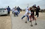 Participants compete in the UN-sponsored Gaza marathon in Beit Hanun in the northern Gaza Strip on March 1, 2012. Thousands of runners braved temperatures hovering just above zero degrees centigrade to take part in the impoverished Palestinian territory's second-ever marathon.