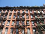 Close-up of some of the old tenement houses. Orchard Street is a street in Manhattan which covers the eight city blocks between Division Street in Chinatown and East Houston Street on the Lower East Side.