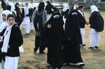 Kashmiri muslim students arrive at the school in Srinagar, the summer capital of Indian Kashmir, 01, March 2012. The school and colleges in Indian Kashmir reopened after three month long winter break. Every year schools in Indian Kashmir close for winter months due to severe cold