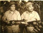 Frank Buck (right) and Duncan Renaldo (left) in Tiger Fangs (1943).