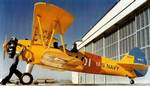 A U.S. sailor cranking the engine of a Stearman N2S-2 Kaydet (BuNo 3553) at the Naval Air Station Corpus Christi, Texas (USA), in 1943.