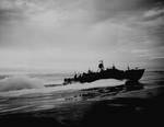 An 80-foot (24 m) Elco PT boat on patrol off the coast of New Guinea, 1943. PTs would usually attack under the cover of night. The cockpits of PT boats were protected against small arms fire and splinters by armor plate.