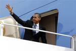 President Barack Obama waves as he boards Air Force One before his departure from Andrews Air Force Base, Md., Friday, March, 9, 2012. (AP Photo/Pablo Martinez Monsivais)