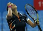 Indian's Sania Mirza reacts during her women's semifinal match against Uzbekistan's Akgul Amanmuradova at the 16th Asian Games in Guangzhou, China, Sunday, Nov. 21, 2010.