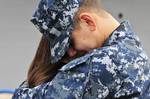 Culinary Specialist 3rd Class Abel Duran hugs his wife before deploying aboard the amphibious transport dock ship USS Cleveland (LPD 7