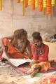 Indian Sadhu, or Hindu holy rest at a temporary camp at Babughat in Kolkata on 05 Jan 2012. Thousands of Hindu pilgrims taka holy dip at Gangasagar, hoping to wash away sins and others to secure a fine spouse, in a sun-worshipping tradition older than Hinduism itself in Eastern India City