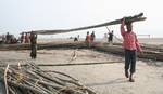 Preparation of Temporary Tent at Sagar Island , Thousands of Hindu pilgrims taka holy dip at Gangasagar, hoping to wash away sins and others to secure a fine spouse, in a sun-worshipping tradition older than Hinduism itself in Eastern India City