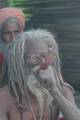 Indian Sadhu, or Hindu holy smoke at a temporary camp at Babughat in Kolkata on 05 Jan 2012. Thousands of Hindu pilgrims taka holy dip at Gangasagar, hoping to wash away sins and others to secure a fine spouse, in a sun-worshipping tradition older than Hinduism itself in Eastern India City