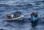 A visit, board, search and seizure team from the guided-missile destroyer USS Pinckney approaches a suspected pirate vessel in the Gulf of Aden, 19 December, 2011.