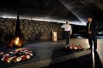 Secretary of the Navy (SECNAV) the Honorable Dr. Donald C. Winter pays his respects with a moment of silence during a wreath laying ceremony at the Yad Vashem Holocaust Museum.