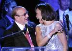 FILE - In this Feb. 13, 2011 file photo, producer Clive Davis shares a moment with singer Whitney Houston performs at the pre-Grammy gala & salute to industry icons with Clive Davis honoring David Geffen in Beverly Hills, Calif. The demand is overwhelming for Clive Davis' annual pre-Grammy gala. The gala has featured performances from top acts like Whitney Houston, Aretha Franklin and Carlos Santana. This year, The Kinks will take the stage to play a medley of their hits, with the help of Jackso