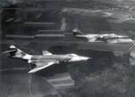 A German RF-104G in flight with a 66th TRW RF-101C. 1,122 aircraft of the main version produced as multi-role fighter-bombers.