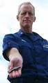 ALAMEDA, Calif. - Cmdr. Kevin F. Bruen, a legal officer for the 11th Coast Guard District, holds a piece of flak fired from a German 88 mm anti-aircraft and anti-tank artillery gun that became lodged in the engine of a B-17 bomber aircraft during a World War II mission, Thursday, June 2, 2011. Bruen's father was the tail gunner in the struck bomber, and Bruen keeps the flak on his desk to remember those who have served in combat. U.S. Coast Guard photo by Dan Dewell. (1267751) ( Anti aircraft an