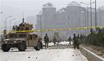 US soldiers secure the site of a suicide car bomber in Kabul, Afghanistan, Saturday, Oct. 29, 2011.