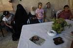 A member of Palestinian prisoner Nasser Nazzal's family shows at a relative's house in the southern Gaza Strip town of Khan Younis on October 15, 2011, as they await his release as part of a deal to secure the exchange of Israeli captive soldier Gilad Shalit. Under a prisoner swap deal signed with Israel, Hamas will free Shalit, held in Gaza since 2006, in exchange for 1,027 Palestinian prisoners. Photo by Ahmed Deeb/wn