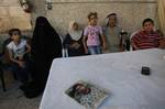 A member of Palestinian prisoner Nasser Nazzal's family shows at a relative's house in the southern Gaza Strip town of Khan Younis on October 15, 2011, as they await his release as part of a deal to secure the exchange of Israeli captive soldier Gilad Shalit. Under a prisoner swap deal signed with Israel, Hamas will free Shalit, held in Gaza since 2006, in exchange for 1,027 Palestinian prisoners. Photo by Ahmed Deeb/wn