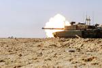 A Challenger 2 battle tank, attached to the Royal Scots Dragoon Guards, fires its main gun during a training exercise in Basra, Iraq, Nov. 17, 2008.