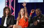 American Idol judges, from left to right, Steven Tyler, Jennifer Lopez, and Randy Jackson, look towards a person asking a question during the American Idol panel at the Fox Broadcasting Company Television Critics Association Winter Press Tour in Pasadena , Calif. on Sunday, Jan. 8, 2012. (AP Photo/Danny Moloshok)