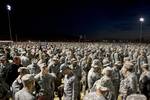 U.S. Army members and participants in the Bataan Memorial Death March wait during the opening ceremony here, March 25. More than 6,700 people came from across the country to honor Bataan Death March survivors and the legacy of those who were prisoners of war or died during that time.