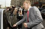 Russian businessman Andrei Lugovoi opens a car door after a news conference in Moscow, Thursday, May 31, 2007. The Russian businessman whom Britain has named as a suspect in the killing of ex-KGB agent Alexander Litvinenko said Thursday that he has evide