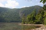 Park at its lowest point along the Hudson River. Biodiversity in the park comes from its collection of different biomes, ranging from brackish tidal marsh and mudflats along the river's edge to pitch pine-oak-heath rocky summit forest and rocky grasslands at higher elevations.