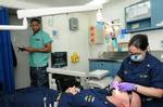 Lt. Brittany Tucker, from Aztec, N.M., conducts a dental exam aboard the aircraft carrier USS Ronald Reagan (CVN 76).