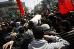 Palestinians carry the body of the Popular Resistance Committees leader Zuheir al-Qessi during his funeral in Rafah in the southern Gaza Strip on 09 March 2012.Israel killed four Gaza militants on Saturday as violence sparked by the death of a militant leader Zuheir al-Qessi a day earlier escalated with gunmen firing more than 90 rockets at Israel, injuring four people, Israeli and Palestinian officials said.Photo by Ahmed DEEb/wn