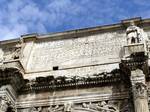 In the central archway, there is one large panel of Trajan's Dacia War on each wall.