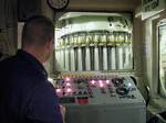 Arabian Gulf (July 15)--GMC James G. Guerette checks the control consol of the 76mm gun mounted on the bow of the CGC Midgett (WHEC 721). The U.S. Coast Guard Cutter Midgett departed homeport of Seattle Washington on June 18, 1999, to deploy with the USS Constellation Battle Group to the Persian Gulf. The Midgett is the first Coast Guard cutter to deploy to the Gulf with a U.S. Navy Battle Group. Once in the Gulf, the Midgetts primary missionis to enforce the United Nation's sanctions that arein