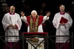 Pope Benedict XVI delivers his blessing at the end of the Via Crucis (Way of the Cross) procession on Good Friday in Rome, Friday, April 6, 2012.