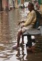 A oldman sit beside the water logged street in kolkata on Friday 06 April 2012 in Eastern India City