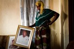 An unidentified daughter of Samba Diallo, the former head of military intelligence, mourns her father's death after he was shot late Sunday night outside a bar near his home in Bissau, Guinea-Bissau, Monday, March 19, 2012. A presidential election that was supposed to stabilize this coup-prone nation was marred by a military assassination just hours after polls closed Sunday.