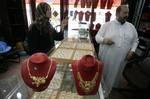 A Palestinian vendor displays a gold jewellery at a jewellery store in the Rafah Refugee Camp, Southern Gaza Strip on September. 19, 2011. Decline in demand for gold in the Palestinian markets due to the high price of $ 50 per gram, this high price in the global gold. ( Photo by Ahmed Deeb/WN)