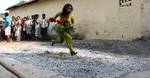 A Hindu Woman devotee Jump on the burning Coal during the Shiva Gajan festival in the village , Hundreds of faithful devotees offer such sacrifices each year in hope of winning the favour of Hindu god Shiva and ensuring the fulfilment of their wishes in Eastern India City