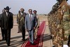 Salva Kiir Mayardit, left, the President of the Government of Southern Sudan, stands alongside Bingu wa Mutharika, center, the President of Malawi, at the airport in the southern Sudanese capital of Juba on Wed. Jan. 26, 2011.