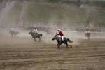 International Lalit and local Drass polo players, in white, compete in a game of polo in Drass, some 160 km east of Kashmiri summer capital Srinagar, on July 10, 2011. The tournament was organised to promote tourism in Jammu and Kashmir as state Chief Minister Omar Abdullah said bringing the valleys onto the international tourist map was among the top priorities of his government.