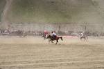 International Lalit and local Drass polo players, in white, compete in a game of polo in Drass, some 160 km east of Kashmiri summer capital Srinagar, on July 10, 2011. The tournament was organised to promote tourism in Jammu and Kashmir as state Chief Minister Omar Abdullah said bringing the valleys onto the international tourist map was among the top priorities of his government.