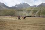 International Lalit and local Drass polo players, in white, compete in a game of polo in Drass, some 160 km east of Kashmiri summer capital Srinagar, on July 10, 2011. The tournament was organised to promote tourism in Jammu and Kashmir as state Chief Minister Omar Abdullah said bringing the valleys onto the international tourist map was among the top priorities of his government.