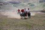 International Lalit and local Drass polo players, in white, compete in a game of polo in Drass, some 160 km east of Kashmiri summer capital Srinagar, on July 10, 2011. The tournament was organised to promote tourism in Jammu and Kashmir as state Chief Minister Omar Abdullah said bringing the valleys onto the international tourist map was among the top priorities of his government.