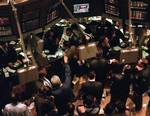 File - Traders watch the Senate impeachment verdict on a television screen while working on the floor of the New York Stock Exchange Friday, Feb. 12, 1999