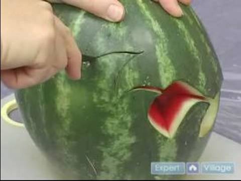 How to Carve Fruit Centerpieces : Cutting Out A Peacock Fruit Centerpiece