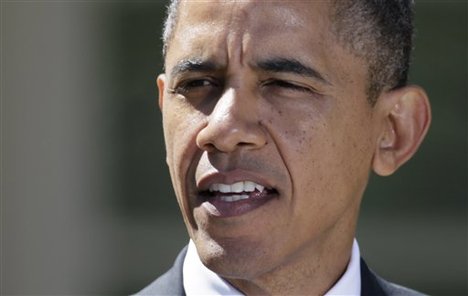 President Barack Obama speaks during a joint news conference with Canadian Prime Minister Stephen Harper, and Mexican President Felipe Calderon, not seen, in the Rose Garden at the White House, Monday, April 2, 2012, in Washington.