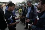 A Palestinian vendor shows his livestock to buyers at market Rafah, southern Gaza Strip, on November 03, 2011 ahead of the Muslim Eid al-Adha festival at the end of the week. Muslims across the world are preparing to celebrate the annual 