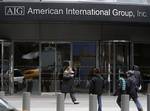 Pedestrians pass an American International Group office building Friday, March 20, 2009, in New York. AIG has handed out $165 million in employee bonuses, a move that has touched off a national firestorm.