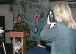 Members of the media from BBC and Anglia television, and radio stations, document the news conference held at the Eagles' Landing, RAF Lakenheath, United Kingdom, by the 48th Fighter Wing Commander, Colonel John T. Brennan, USAF. The news conference held