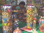 Artisans seen preparing different handicraft articles at the State level Jungle mahal handicraft exhibition at the Midnapore college ground in Midnapore town in Eastern India