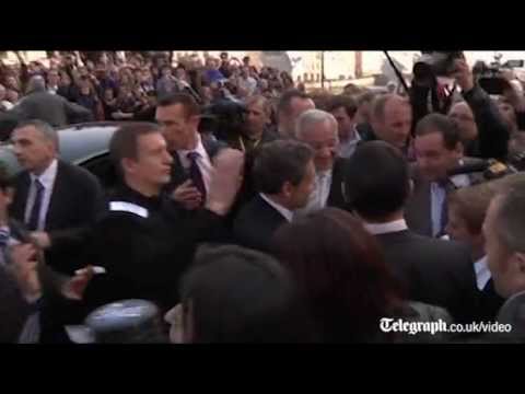 Nicolas Sarkozy penned into bar after being heckled on France presidential election campaign