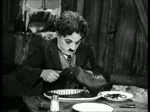 Charlie Chaplin eating his shoe - The Gold Rush (High Quality)